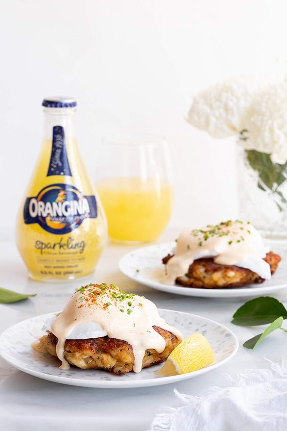 Orangina - Citrus Sparkling Juice Beverage - Light Pulp - Original Imported European French Recipe - No Artificial Ingredients - (Pack of 12) (8.5 oz Bottle)